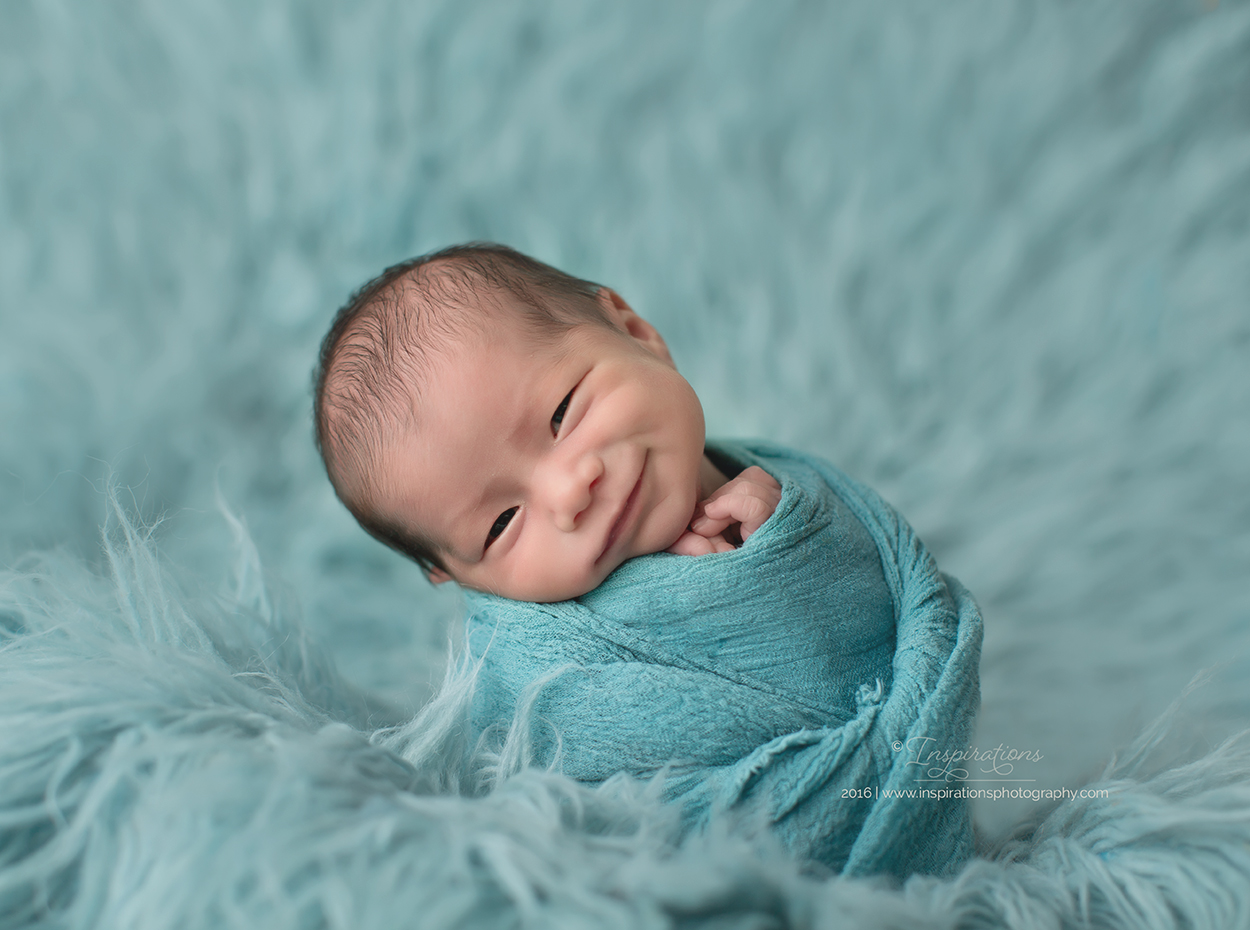 Newborn swaddled in blanket